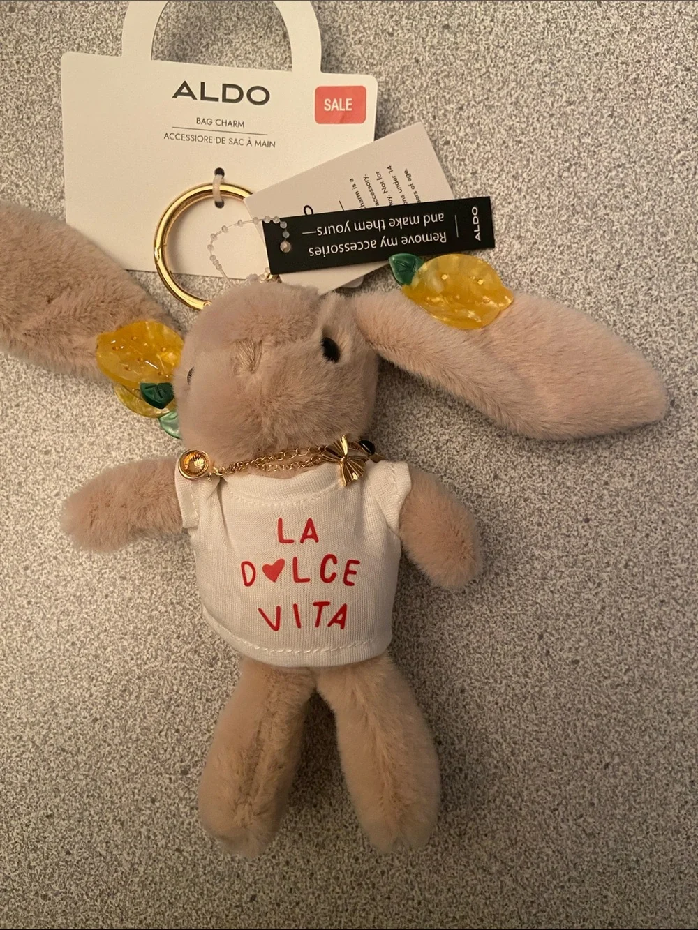 ALDO Beige Bunny Bag Charm with Yellow Leaf Accents